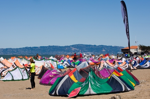 Kiteboarders prepare their kites for competition on the beach at Crissy Field.